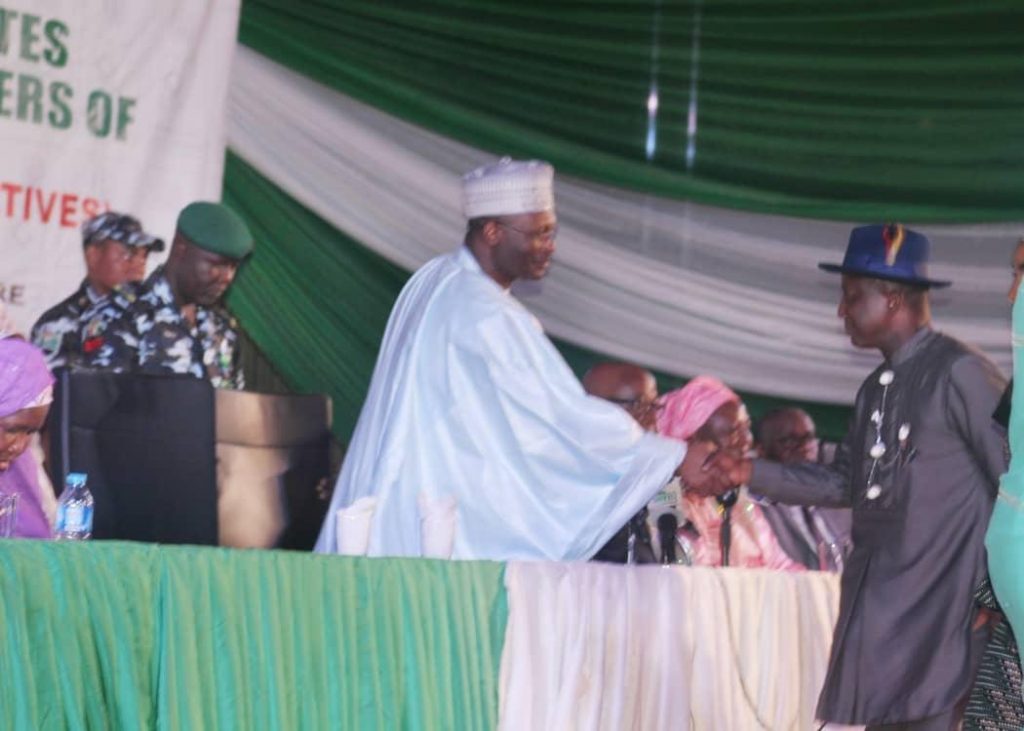 Professor Steve Azaiki congratulated by Professor Mahmood Yakubu INEC Chairman